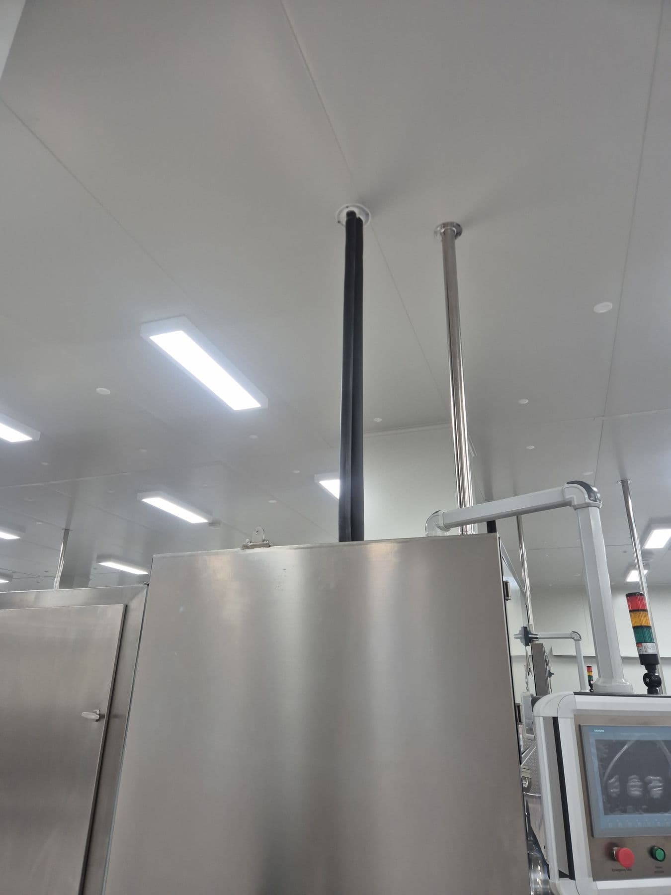 Inside a commercial cool room with shelving and evaporator fans